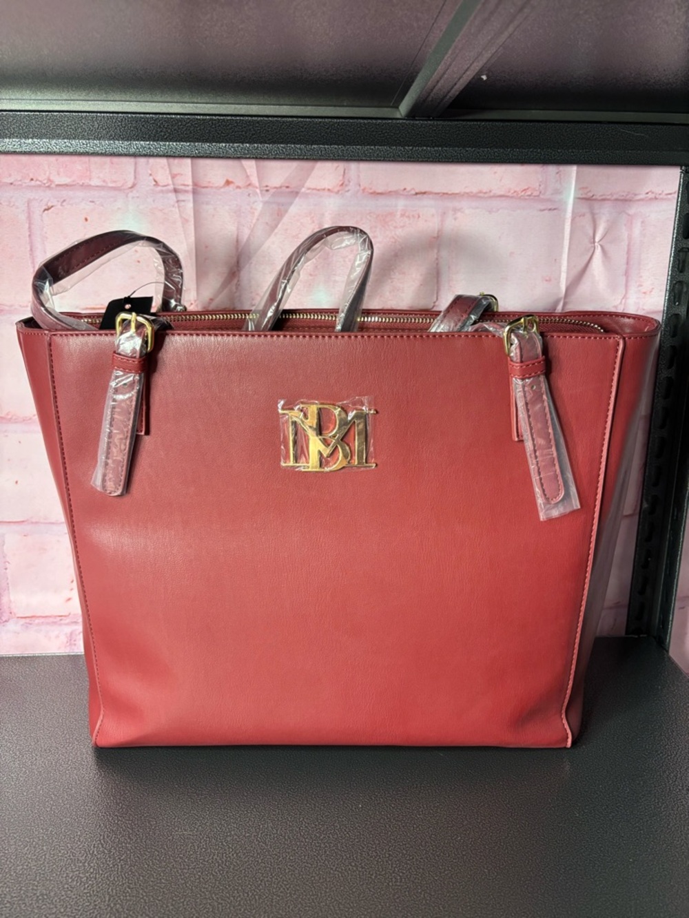 Badgley Mischka wine colored Tote  with Gold Logo